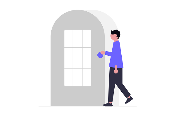 A young light skinned man with short black hair is grabbing a door handle to walk through a door